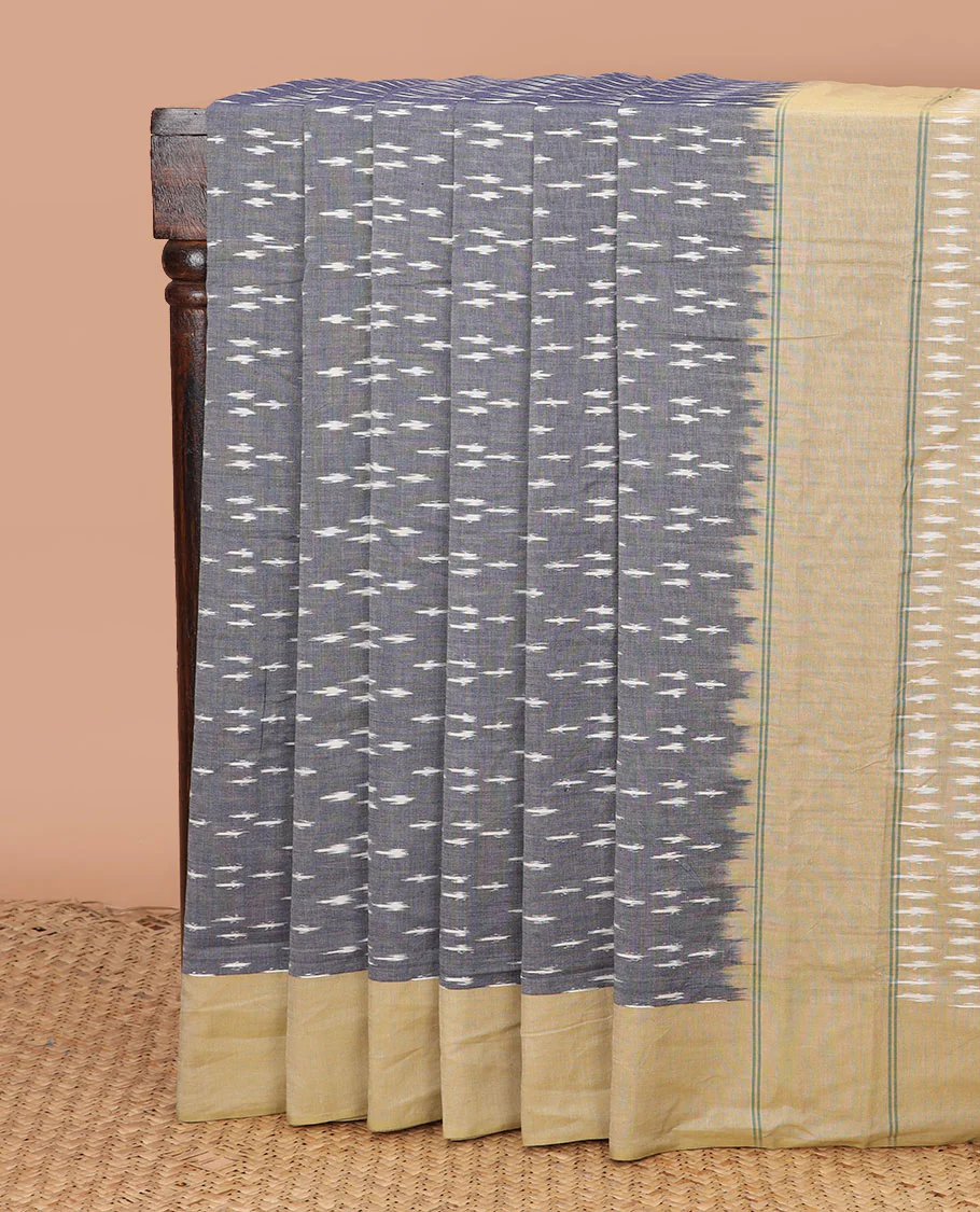 Grey Ikkat Cotton Saree Woven with Buttas in Ikkat Weave, Complemented by a Contrast Plain Border, and Pallu Featuring Ikkat Buttas