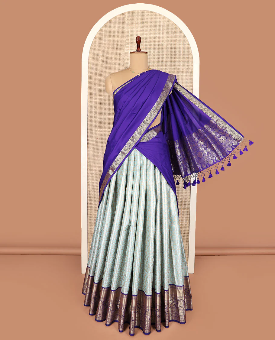 Blue jacquard art silk half-saree, contrast traditional zari border skirt, contrast jacquard blouse, and a floral design woven dhavani