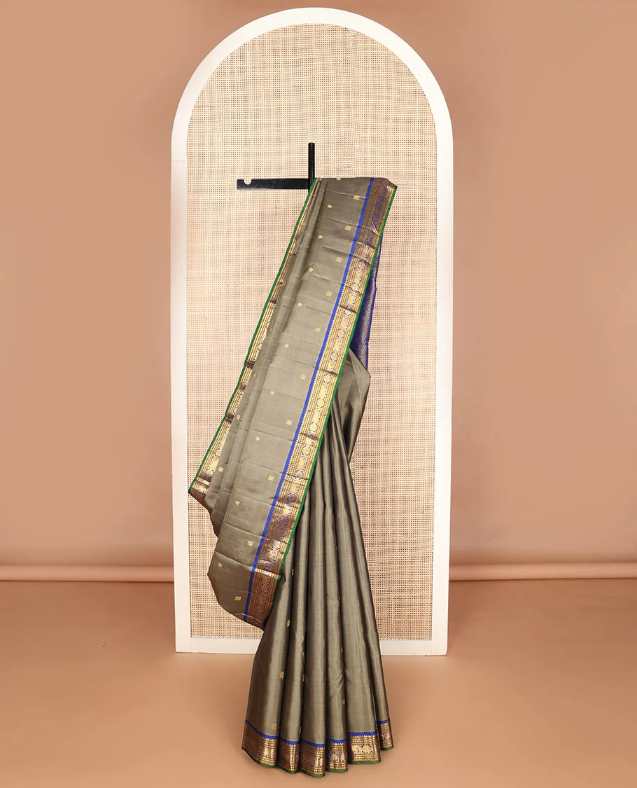 Grey mayil chakram buttas silk saree, contrast border of thilakam mokku,banaras,neli,yaanai & manga & pallu of intricate designs