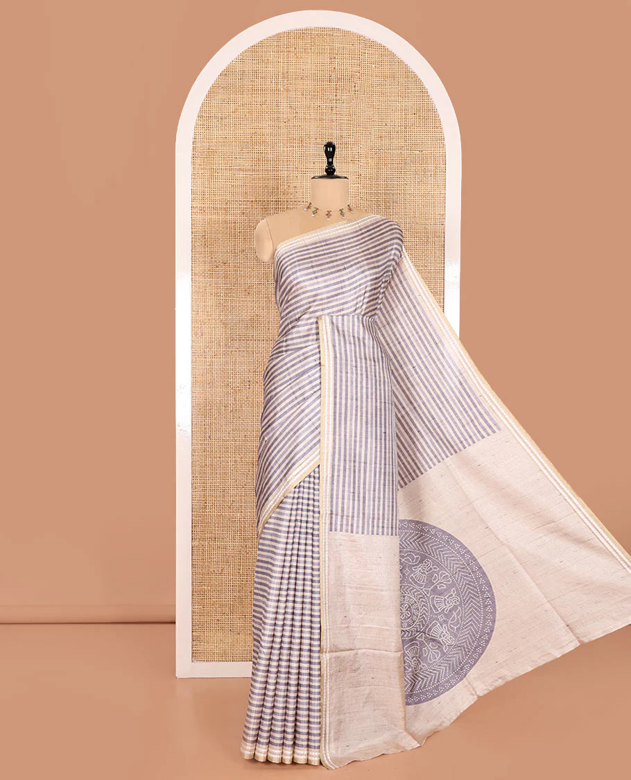 Grey Semi-Tussar Saree Featuring Horizontal Stripe Prints, Accentuated by a Subtle Resham Thread Temple-Designed Border, with a Pallu Highlighted by Intricate Circular Motifs, Paired with a Contrast Bandhani Blouse