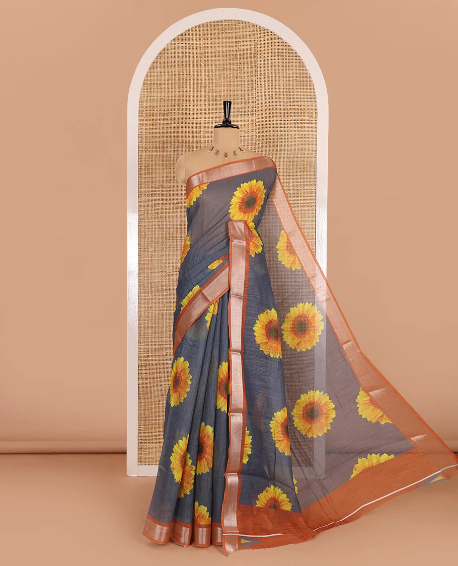 Grey sunflower motifs printed linen cotton saree, contrast zari border, sunflower motifs printed pallu, and contrast temple printed blouse