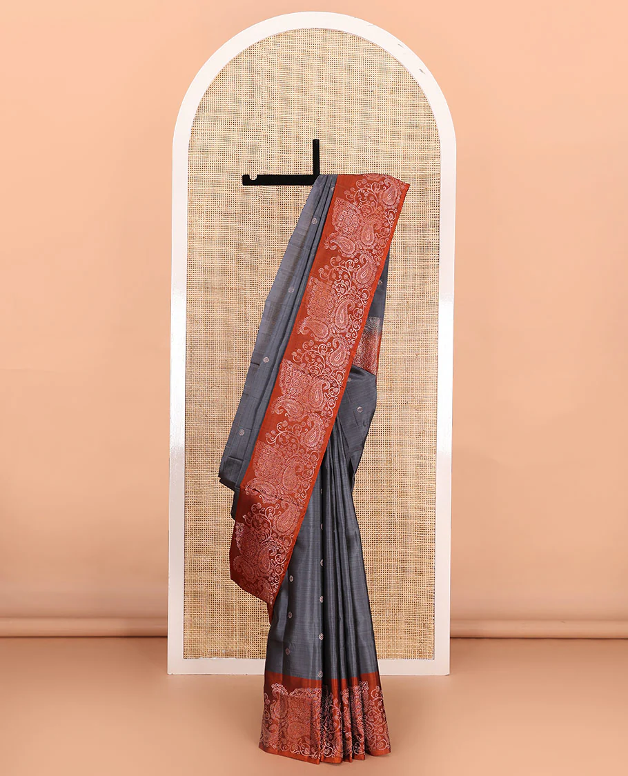 Grey zari buttas Mayuri soft silk saree, contrast border of paisleys and chakram designs, and pallu of intricate designs