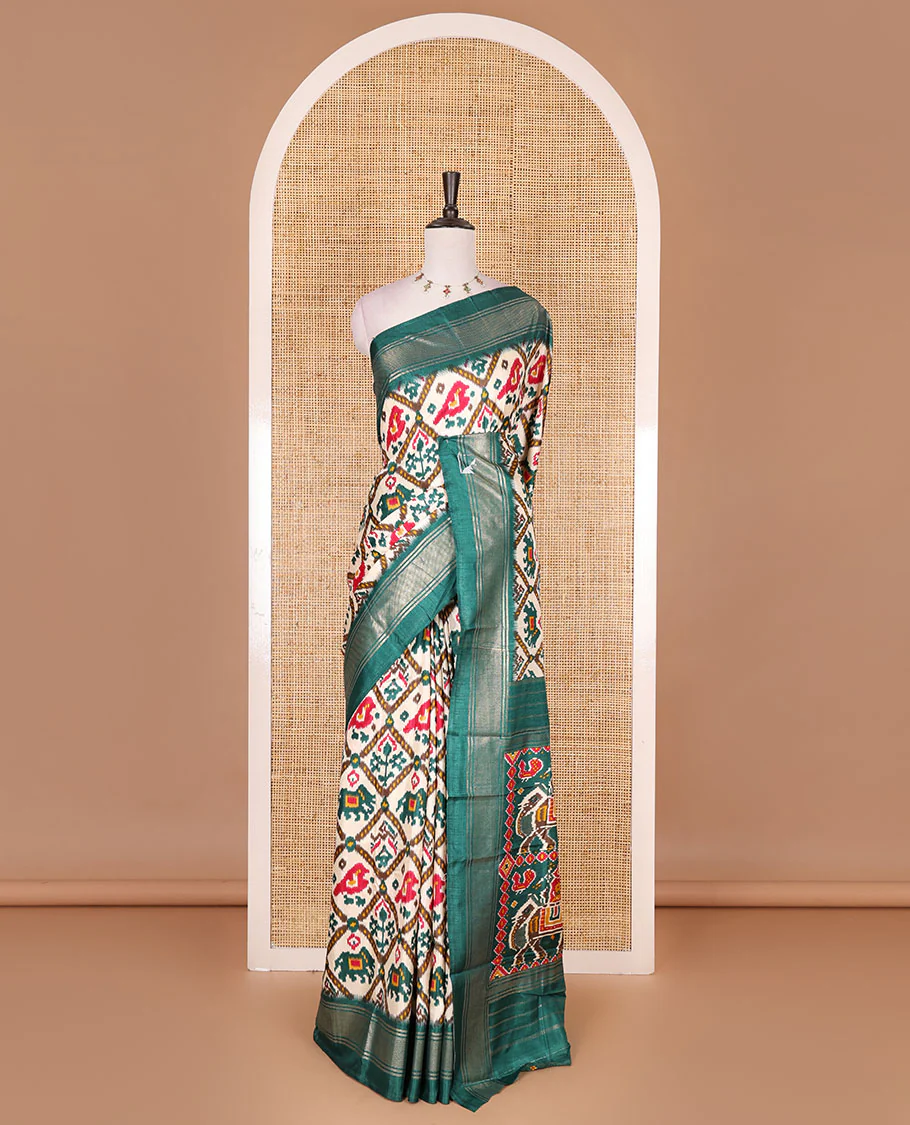 Half-white and green buttas enclosed jaal patterned patola-inspired pochampally dola silk saree, contrast green zari border, patola elephant pallu, and contrast blouse - Image 2