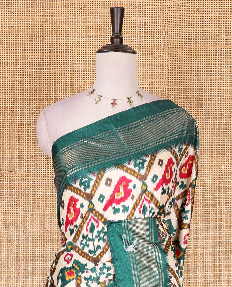 Half-white and green buttas enclosed jaal patterned patola-inspired pochampally dola silk saree, contrast green zari border, patola elephant pallu, and contrast blouse - Image 3