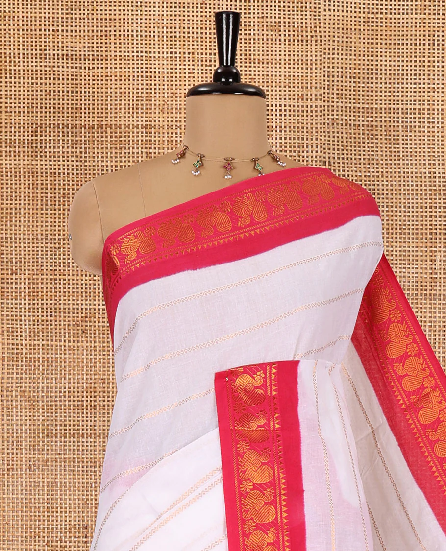 Half-white and rani pink Veldhari striped Sungudi cotton saree, contrast traditional border of peacock buttas, zari striped pallu, and a contrast blouse - Image 2
