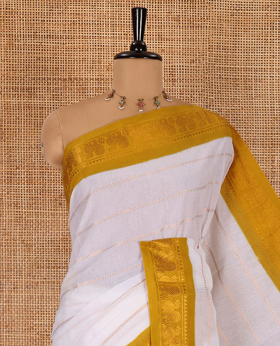 Half-white and yellow Veldhari striped Sungudi cotton saree, contrast traditional border of peacock buttas, zari striped pallu, and a contrast blouse - Image 2