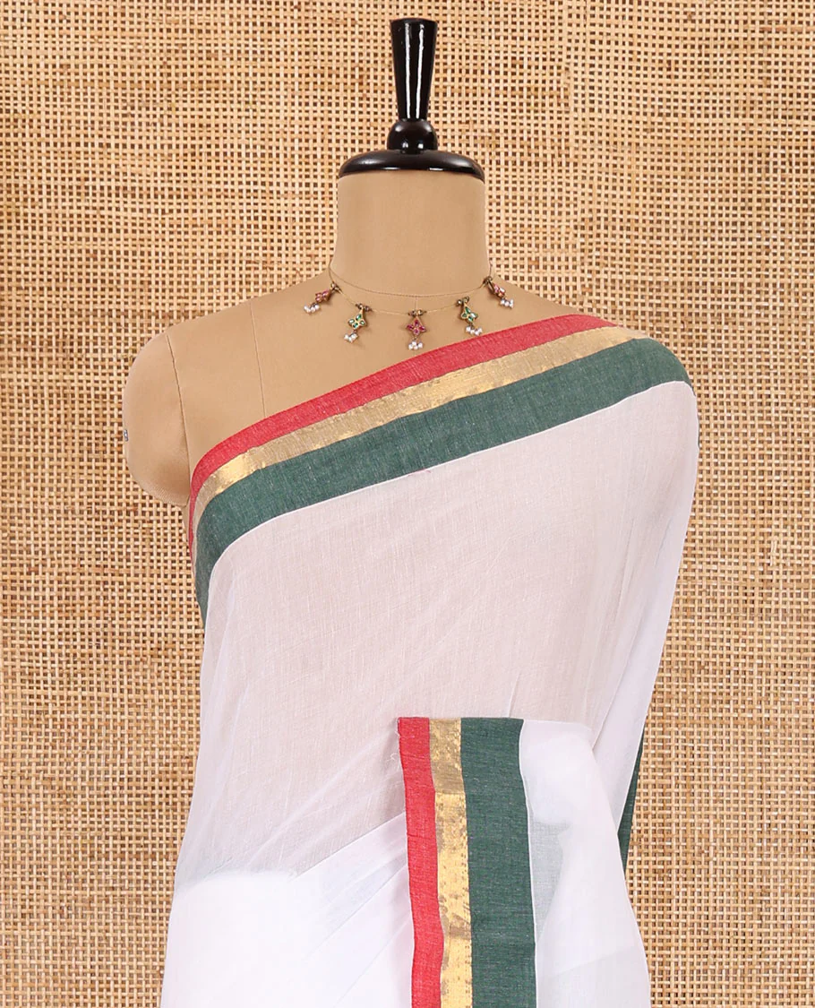 Half-white full-plain Khadi mul cotton saree, contrast red and green zari border, plain pallu, and a plain blouse - Image 3
