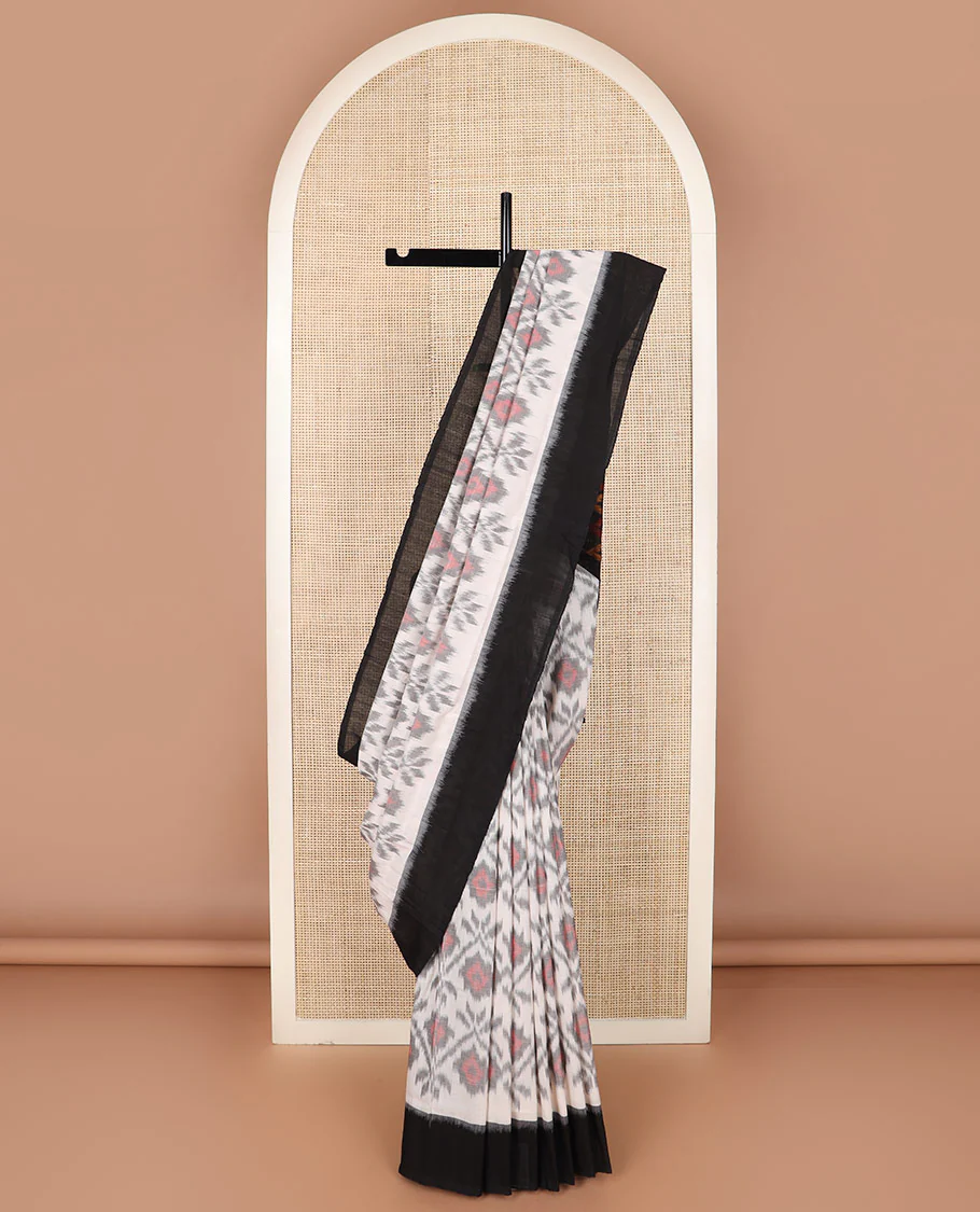 Half-white geometric design Pochampally ikkat saree, contrast plain black border, and ikkat design pallu