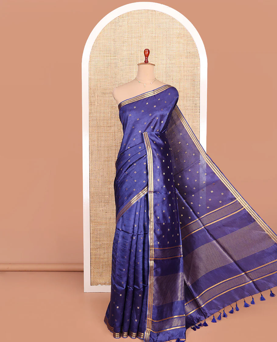 Ink Blue Banana Pith Saree Finely Woven with Square-Shaped Zari Buttas, Subtly Woven Zari Piping Border, Pallu Gleamed Up with Zari Stripes, and Paired with a Matching Blouse