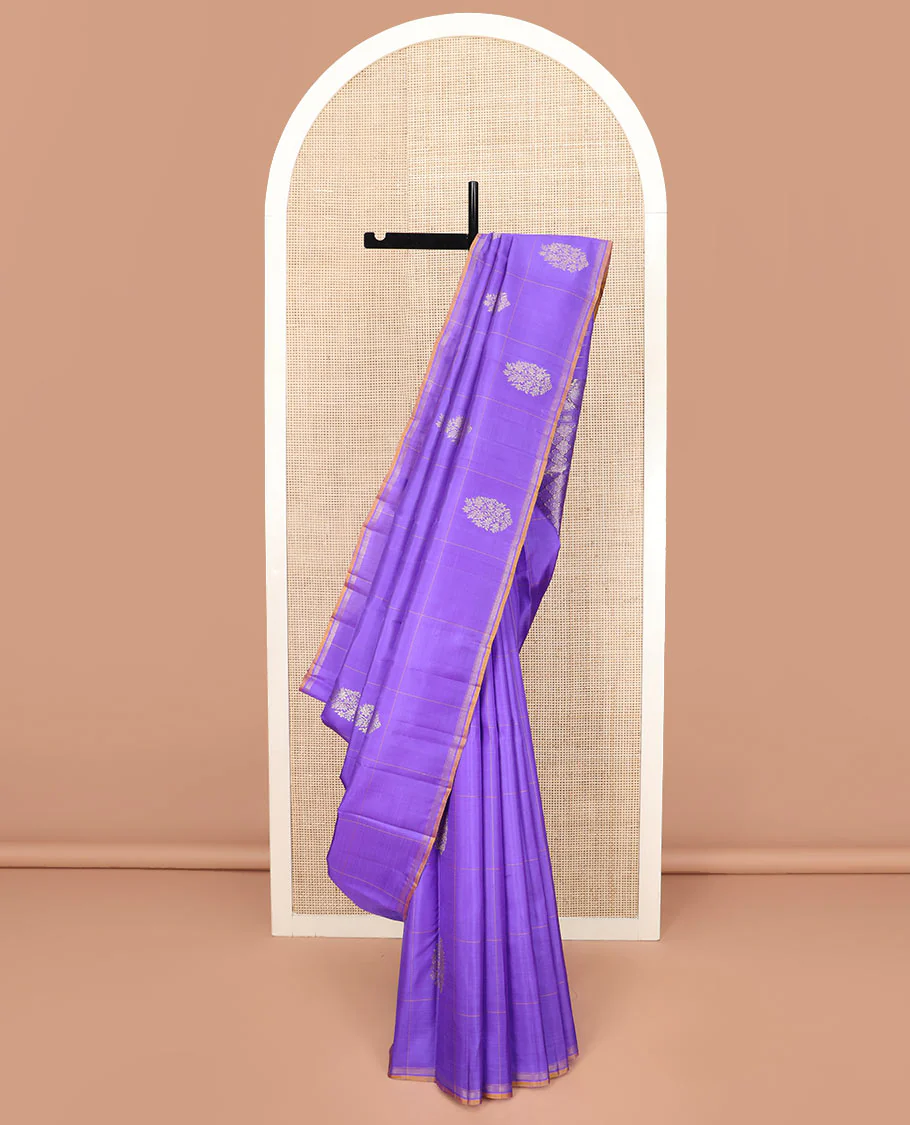 Lavender Kanchipuram Silk Saree Featuring Buttas Enclosed Checks, Adorned with a Contrast Piping Border, Zari Elevated Pallu of Jaal Design, and Paired with a Matching Checked Blouse
