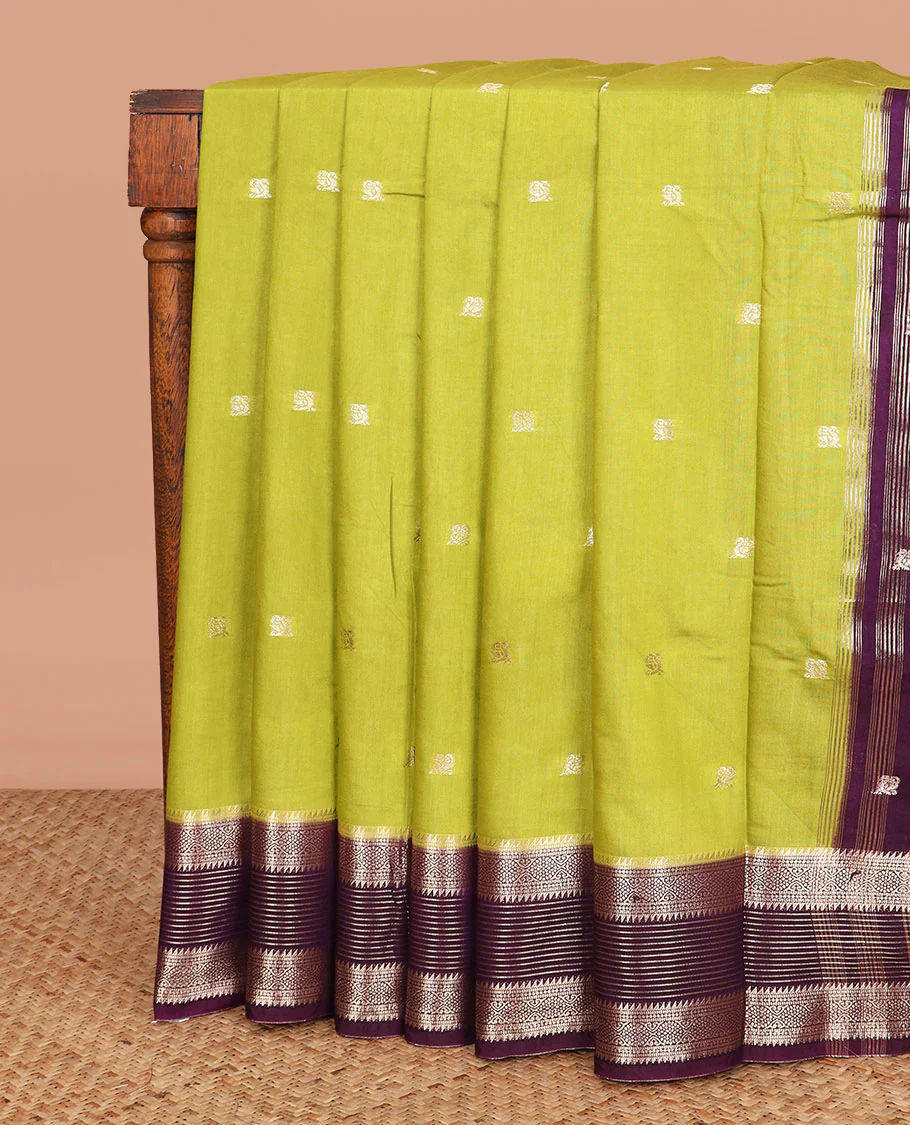 Leaf green peacock buttas assam silk saree, contrast traditional zari border, and pallu of zari design