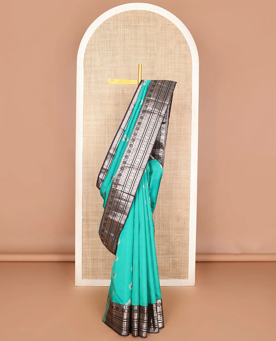 Light blue zari buttas Vasundhara Lite Silk Mix Saree, contrast temple border of kodi visiry, kathir & Annam chakram & intricate pallu