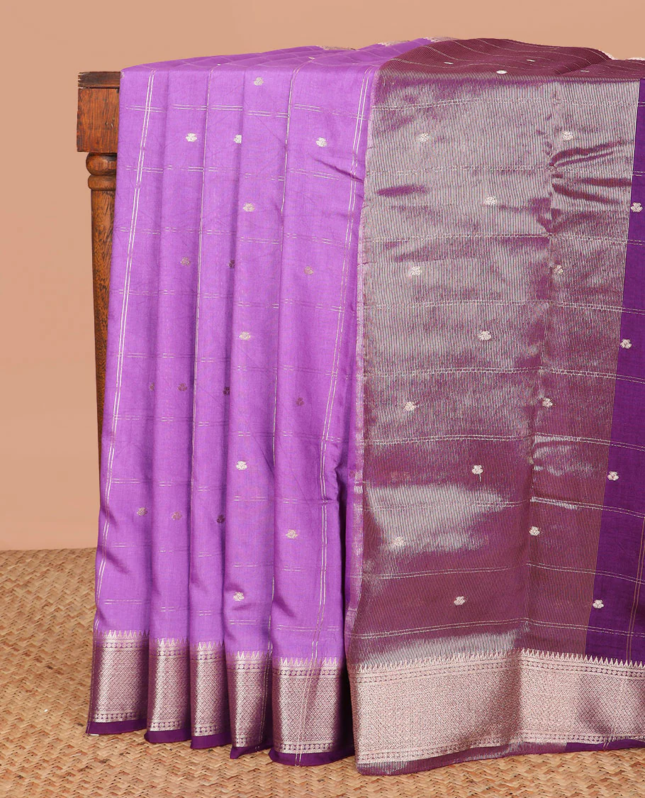 Light purple buttas enclosed checked assam silk saree, contrast traditional zari border, and pallu of zari design