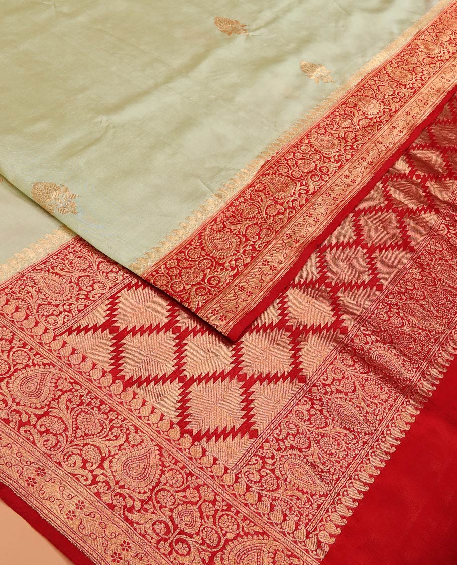 Light Sandal Raw Mango Silk Saree Beautified with Buttas, Featuring a Contrast Paisley Zari-Designed Border, a Zari-Elevated Jaal Pallu, Paired with a Contrast Blouse - Image 2