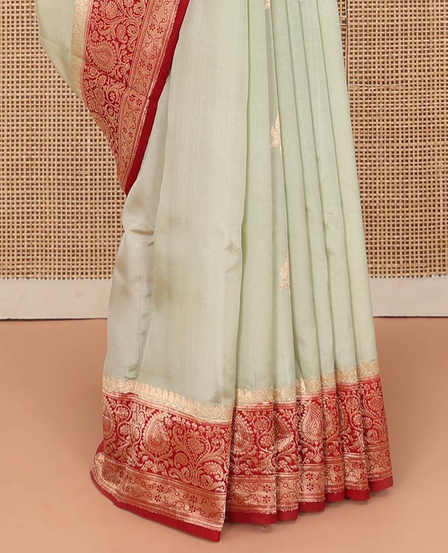 Light Sandal Raw Mango Silk Saree Beautified with Buttas, Featuring a Contrast Paisley Zari-Designed Border, a Zari-Elevated Jaal Pallu, Paired with a Contrast Blouse - Image 4