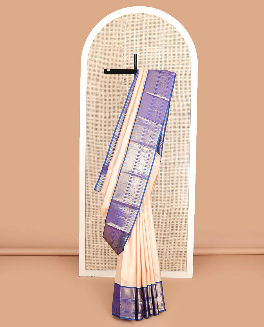 Light sandal zari buttas Vasundhara silk saree, contrast border of vanki, banaras, muthu, kathir, and Pichwai cow motifs zari weave, and pallu of manga designs