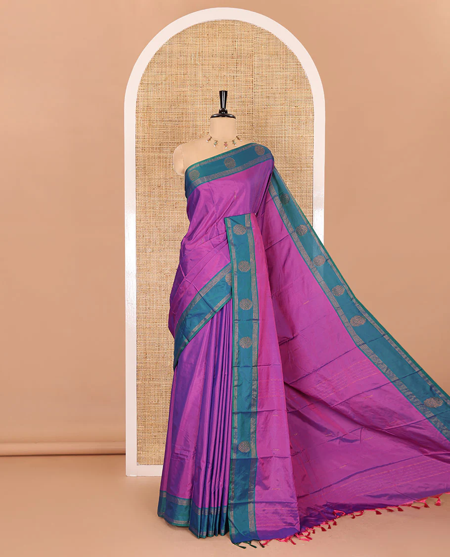 Magenta buttas semi-soft silk saree, contrast zari striped and round buttas border, striped pallu, and a matching blouse