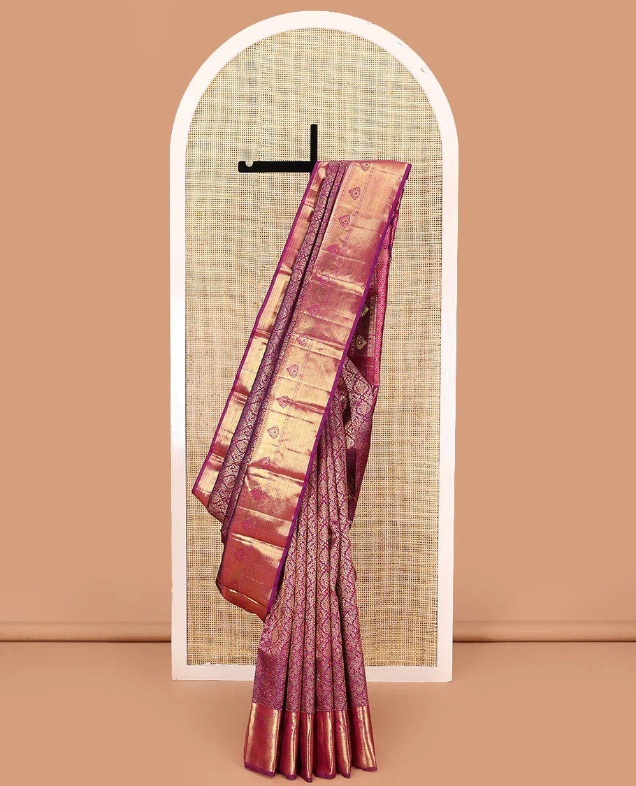 Magenta jacquard kanchipuram silk saree, zari border of thilakam, banaras, muthu, rudraksham designs, and jaal pallu