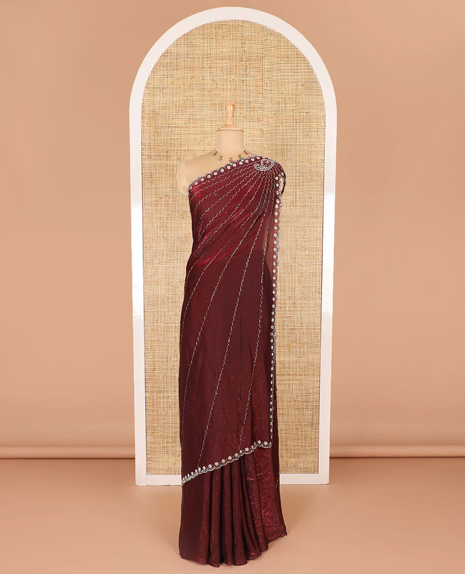 Maroon micro-stone work fendy chiffon saree with paisley stone work on its shoulder, a scallop stone work border, a butterfly style pallu, and a matching stone work blouse - Image 2