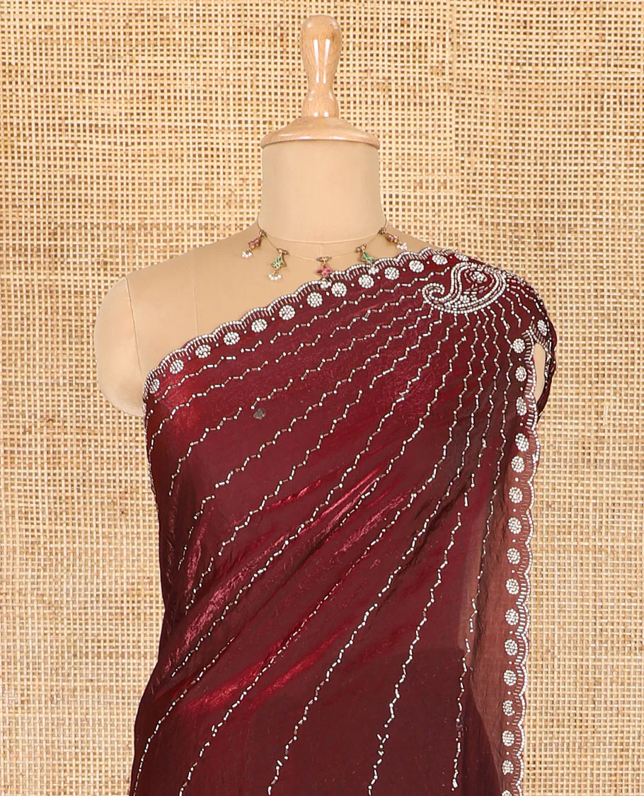 Maroon micro-stone work fendy chiffon saree with paisley stone work on its shoulder, a scallop stone work border, a butterfly style pallu, and a matching stone work blouse - Image 3