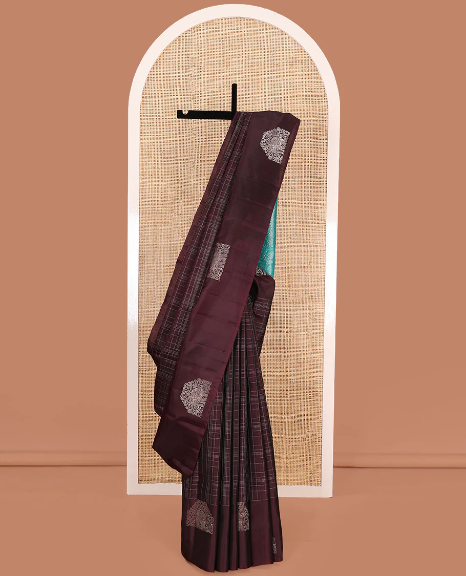 Maroon muthu kattam Kanchipuram silk saree, yaanai motifs zari border, and contrast pallu of yaanai, and chakram buttas