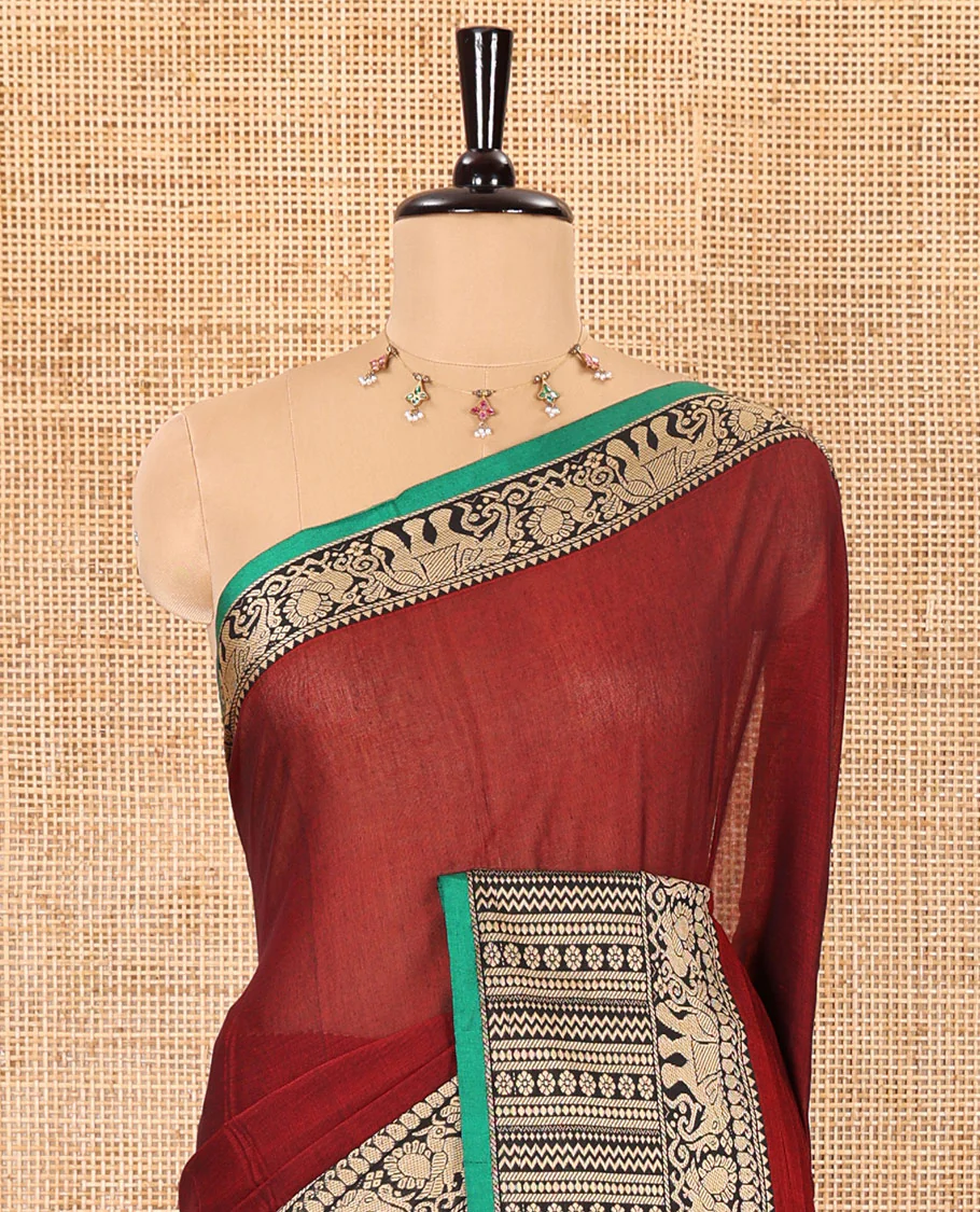 Maroon plain mercerised cotton saree, contrast traditional motifs thread woven border, striped pallu, and a matching blouse - Image 3