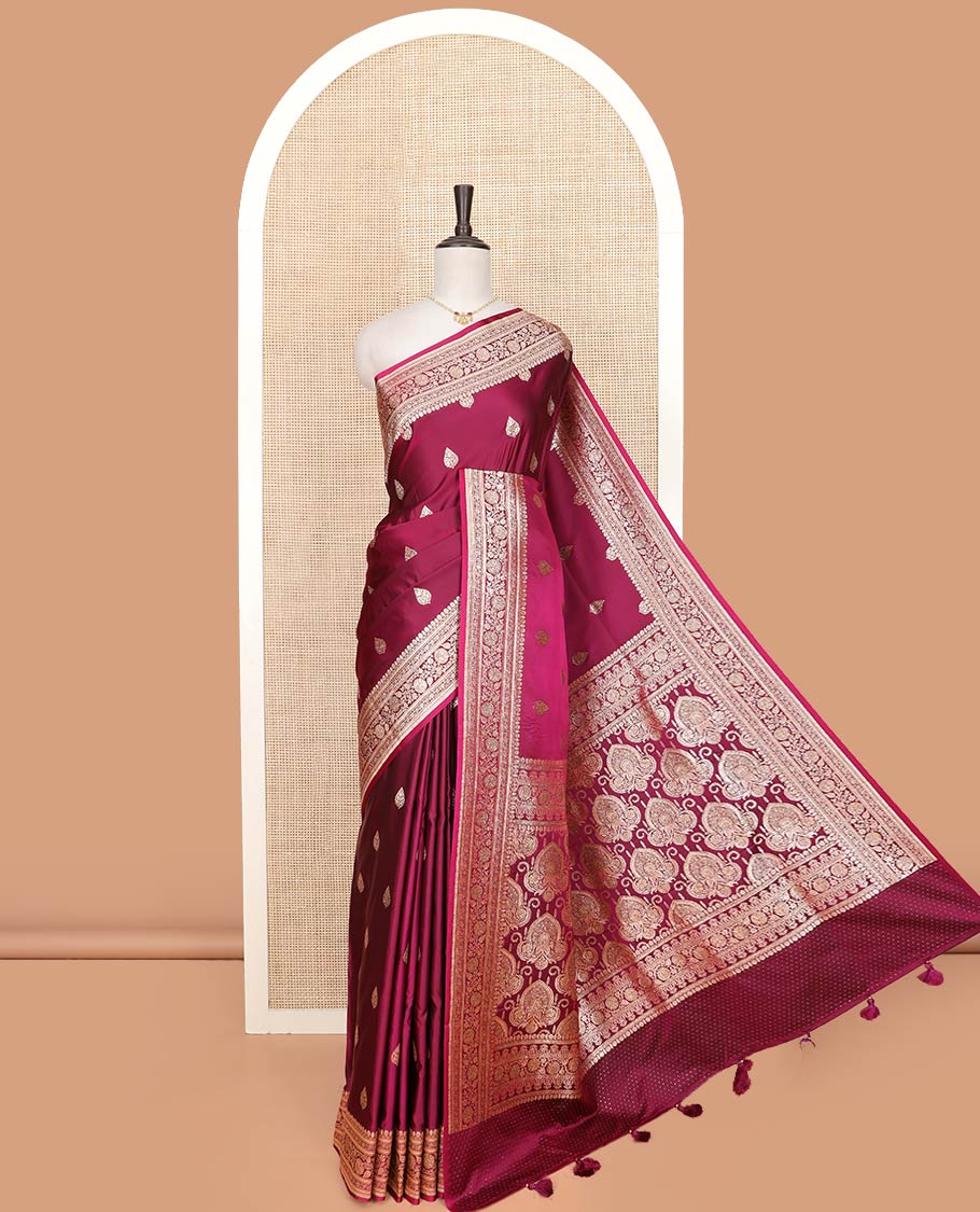 Maroon thilakam buttas banarasi silk saree, traditional zari border of floral creeper designs, and pallu of intricate designs