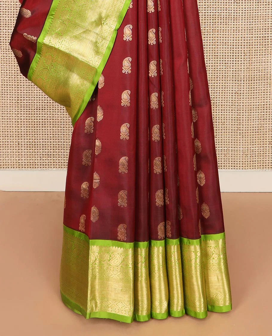 Maroon zari buttas Vasundhara silk saree, contrast border of rekku, muthu, banaras, manga, kamalam, diamond, and vanki designs, and diagonal striped pallu - Image 4