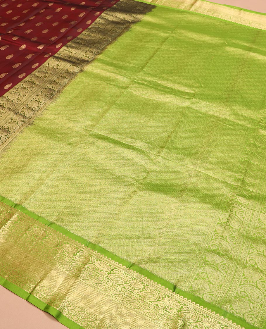 Maroon zari buttas Vasundhara silk saree, contrast border of rekku, muthu, banaras, manga, kamalam, diamond, and vanki designs, and diagonal striped pallu - Image 5