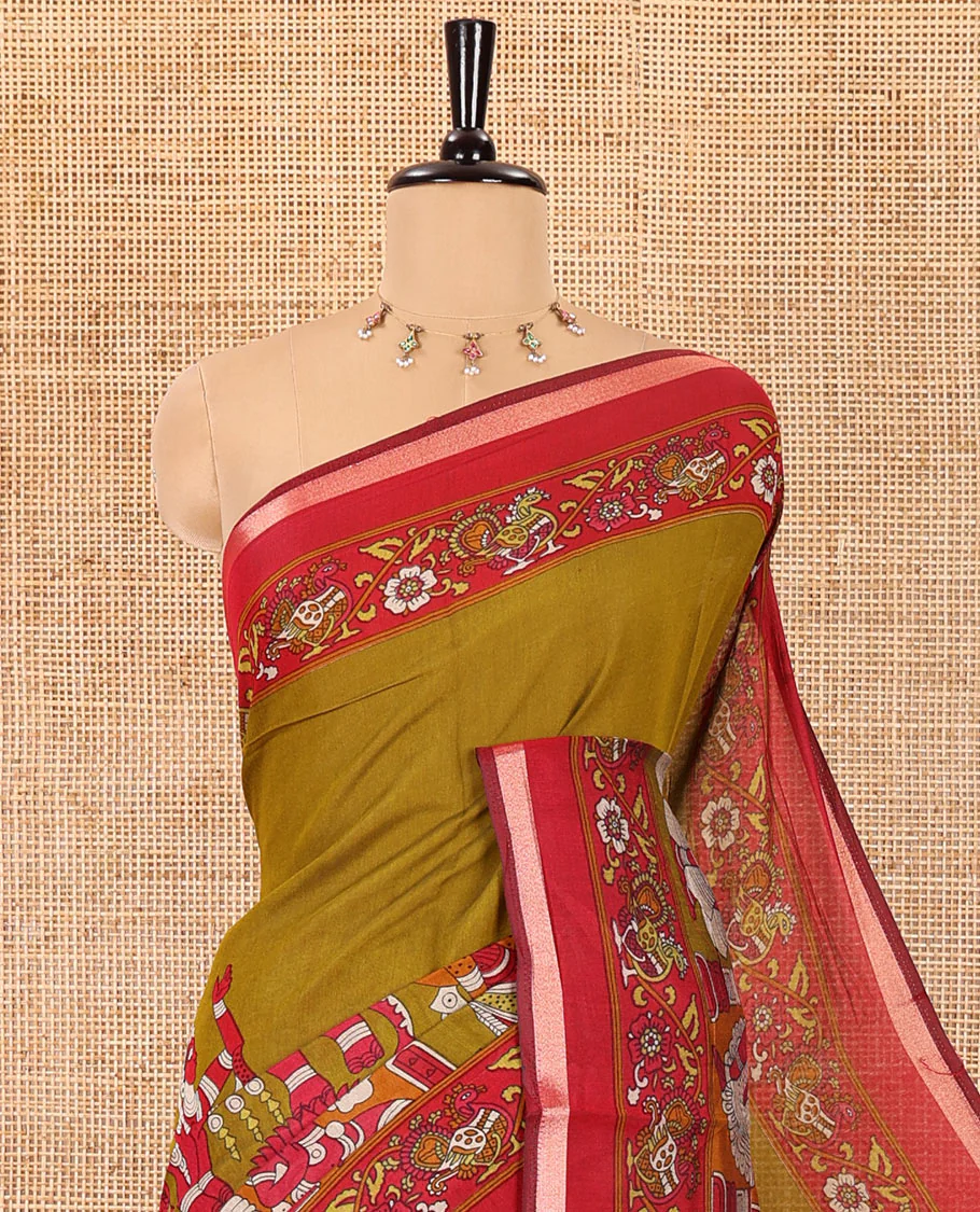Mehendi green human figurines printed muslin cotton saree, contrast floral-peacock printed border of piping work, kalamkari printed pallu, and a contrast blouse of flower motifs print - Image 2