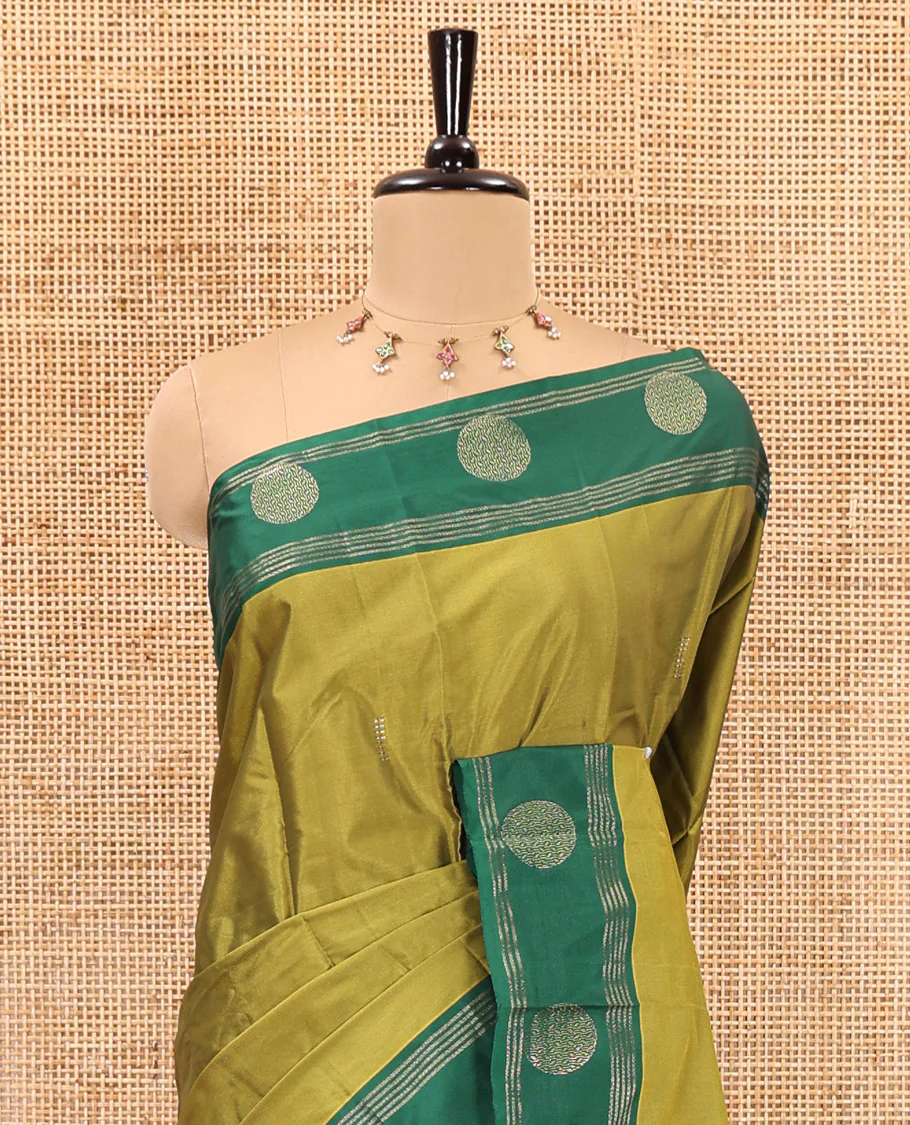 Olive Green dobby style buttas semi-soft silk saree, contrast round buttas and striped border, striped pallu, and a plain blouse - Image 3