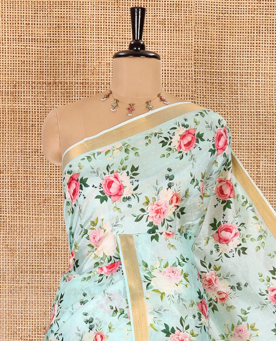 Mint green colorful rose floral motifs digital printed banana pith saree, piping border, striped pallu, and floral printed blouse - Image 2