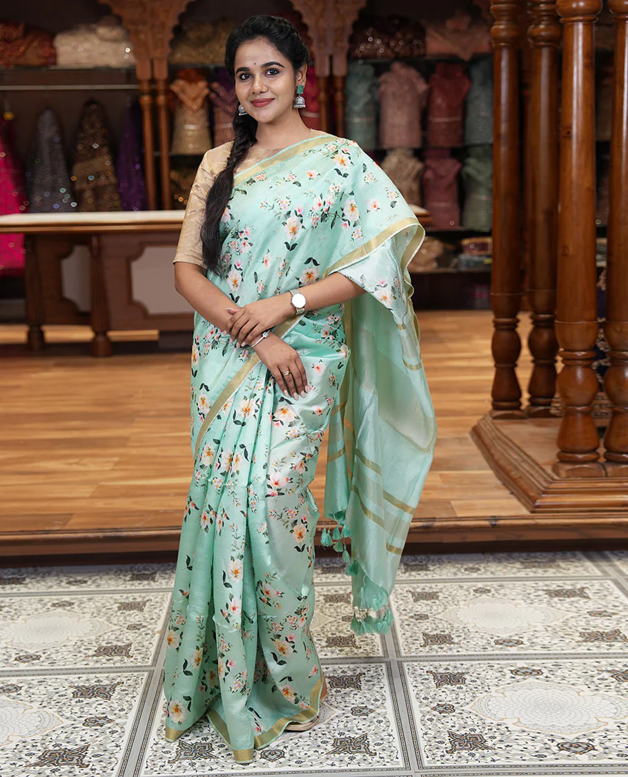 Mint green floral motifs digital printed banana pith saree, piping border, striped pallu, and floral printed blouse