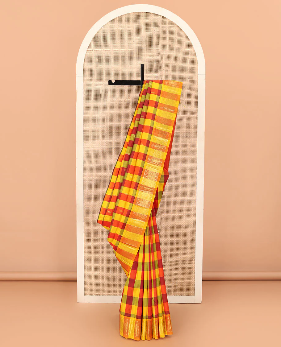 Multi-color checked and zari buttas Kanchipuram silk saree, one-sided border of paneer sombu, banaras, muthu, and jaal designs, and zari design pallu