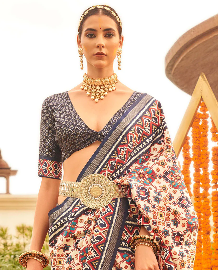 Multi-color intricate patola printed designer saree, contrast blue ikkat border, and floral design pallu - Image 2