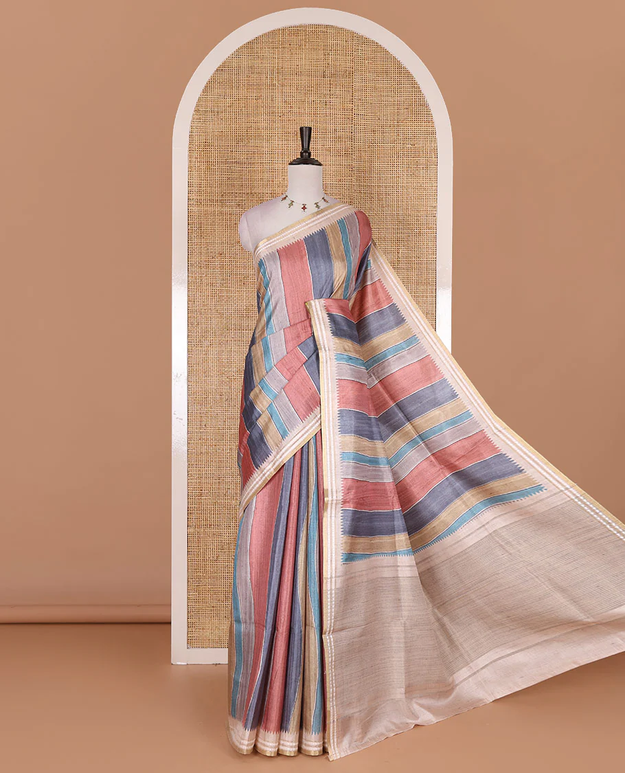 Multi color vertically striped semi-tussar saree, contrast resham thread border of temple and rudraksham motifs, striped pallu, and contrast striped printed blouse