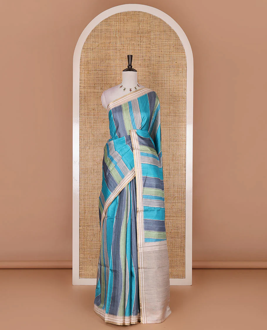 Multi color vertically striped semi-tussar saree, contrast resham thread border of temple and rudraksham motifs, striped pallu, and contrast striped printed blouse - Image 2