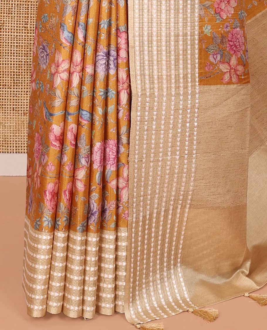 Mustard colorful floral motifs printed fancy tussar saree, contrast triangle motifs border, striped pallu, and a contrast striped blouse - Image 3