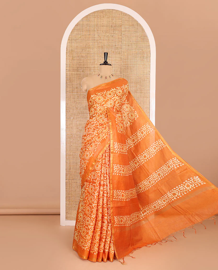 Mustard floral design batik-printed Bhagalpur cotton saree, zari piping border, batik-printed pallu, and a plain blouse