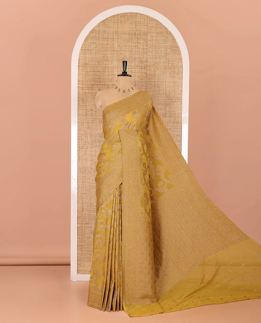 Mustard jaal jacquard fancy crepe banaras khaddi saree, floral creeper design border, ogee patterned pallu, and a matching blouse
