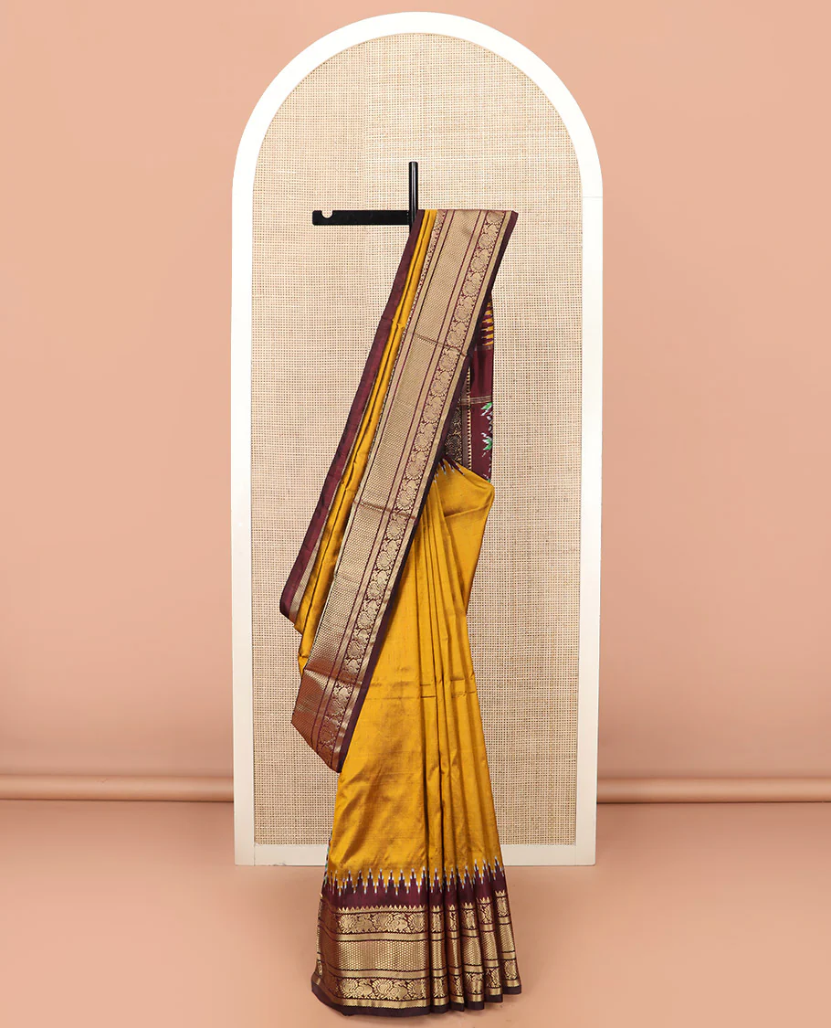 Mustard Plain Ikkat Silk Saree, Complemented by a Contrast Temple Traditional Zari Motif Woven Border, Pallu Adorned with Vibrant Jaal Design, and Paired with a Multi-Coloured Blouse - Image 2