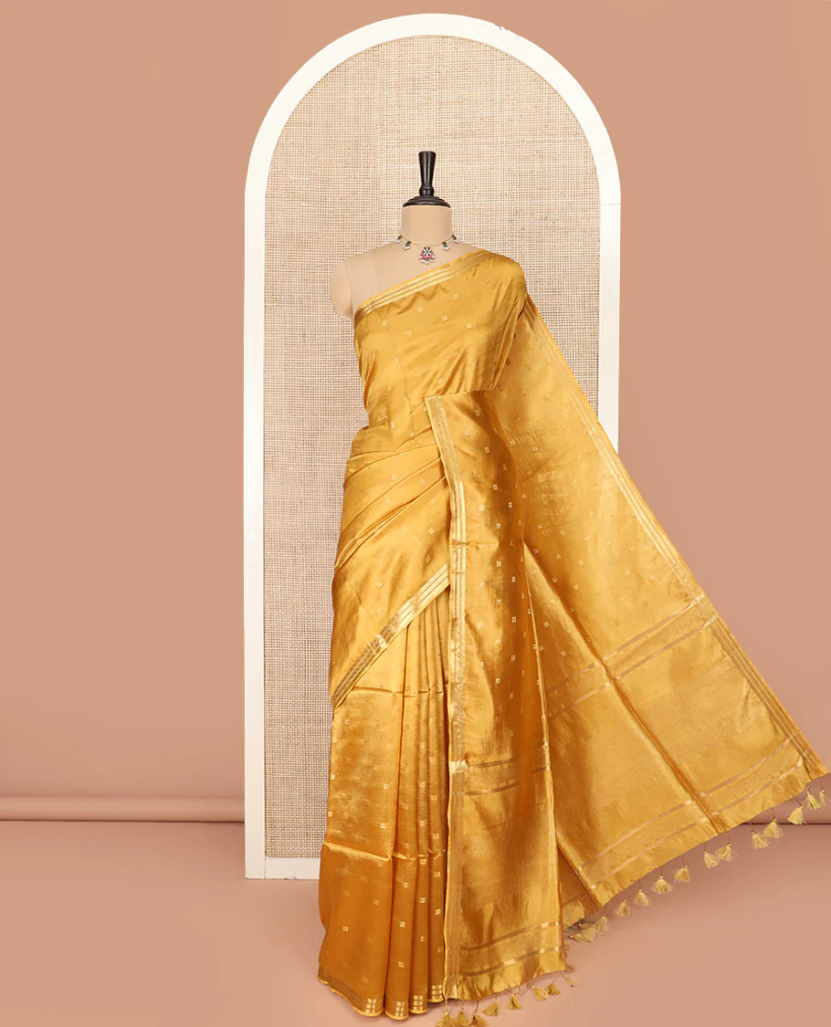 Mustrad Banana Pith Saree Subtly Sparkled with Zari Buttas Woven All Over Its Body, Subtle Piping Zari Border, Gleaming Zari Stripes Woven Pallu, and Paired with a Matching Plain Blouse