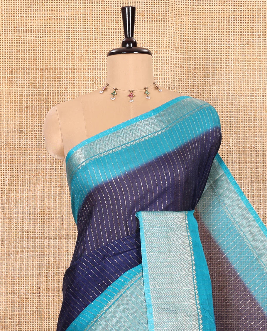 Navy Blue and Blue Dola Silk Saree Subtly Sparked with Vertical Golden Stripes Running All Over Its Body, Complemented by a Contrast Traditional Zari Design Woven Border, Subtly Striped Pallu, and a Contrast Buttas Woven Blouse - Image 2