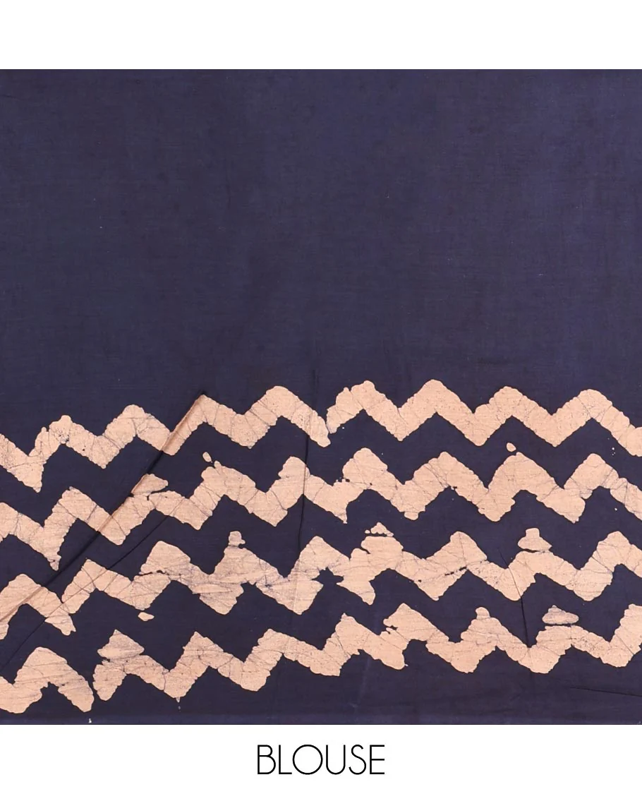 Navy blue wax batik-style zig-zag printed pure cotton saree, gold zari piping border, human figurines batik printed pallu, and a matching blouse - Image 4