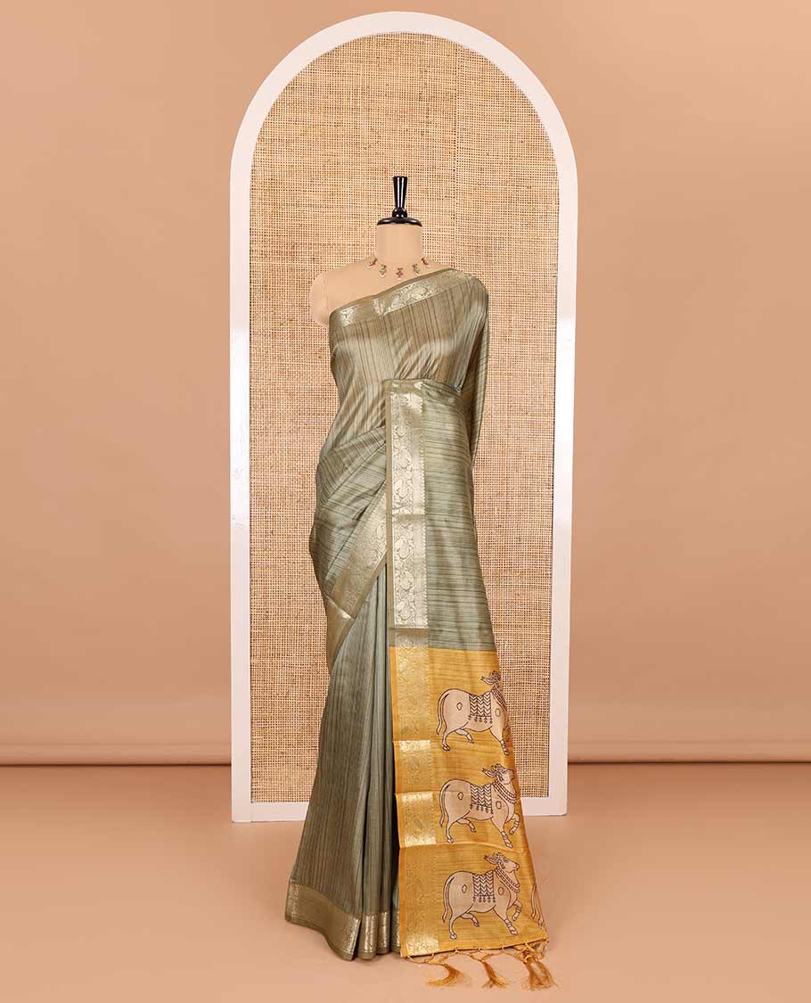 Olive green striped semi-tussar saree, traditional zari border of floral creeper designs, contrast pallu of Pichwai cow print, and contrast Pichwai cow printed blouse - Image 2