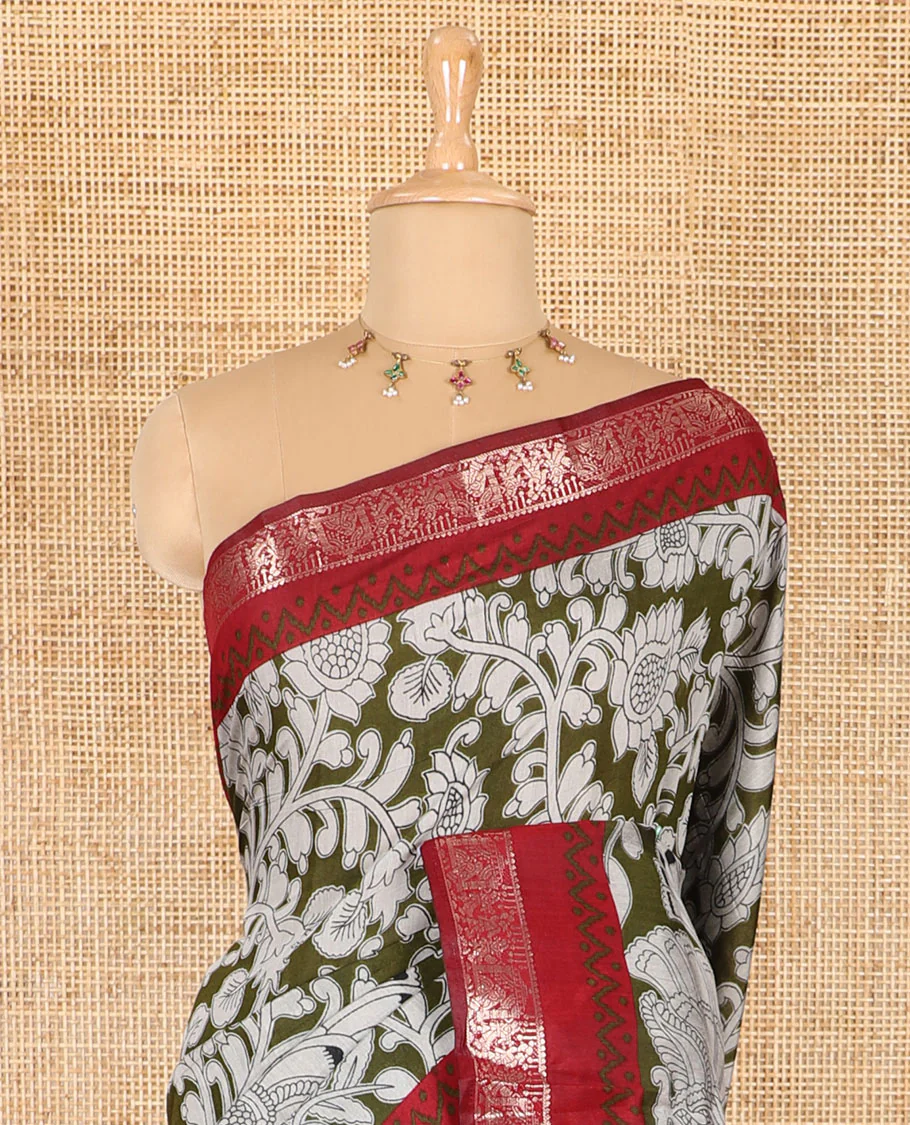 Olive kalamkari floral vine and peacock printed muslin cotton saree, contrast zari border, kalamkari peacock printed pallu, and a contrast coin buttas printed blouse - Image 3