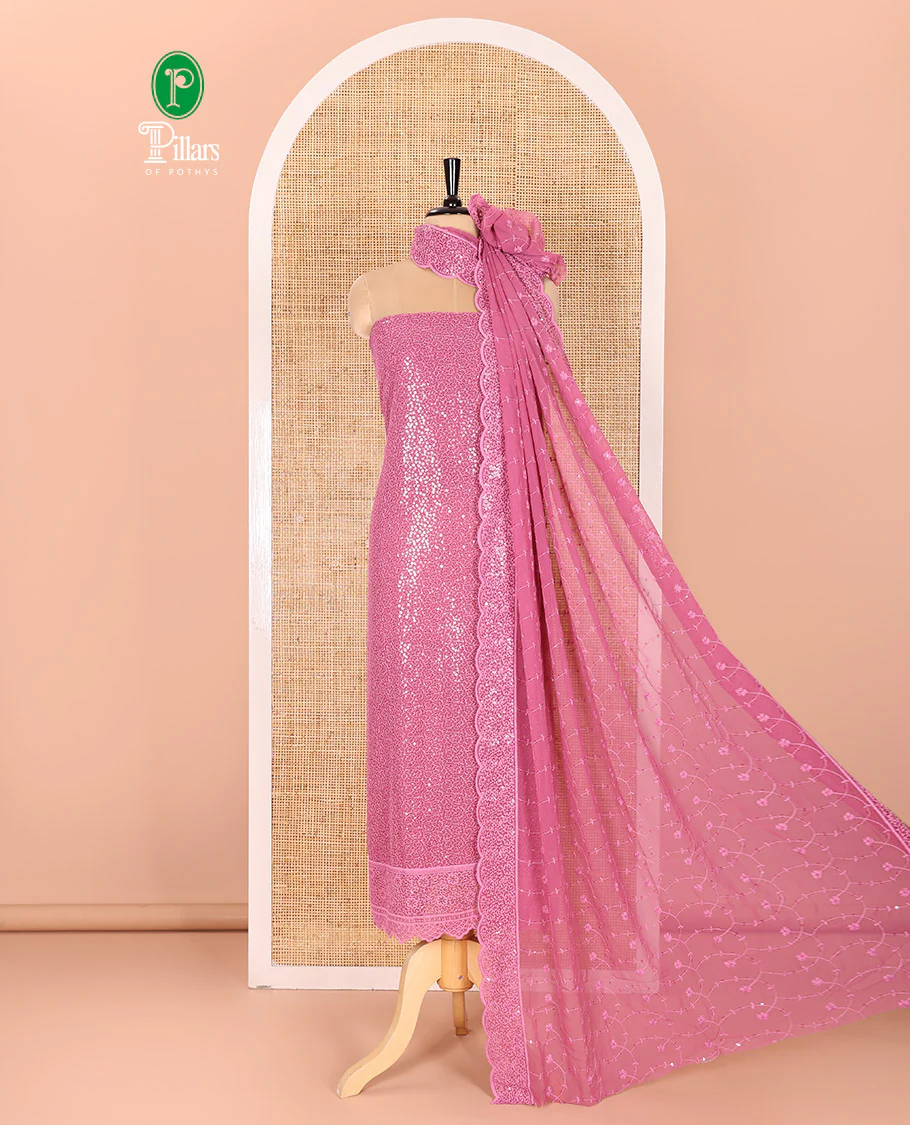 Onion Pink Material Chudidar Set Features Sequin Embroidered Georgette Top, a Plain American Crepe Bottom, and a Scallop Dupatta Embellished with Floral Vine Embroidery