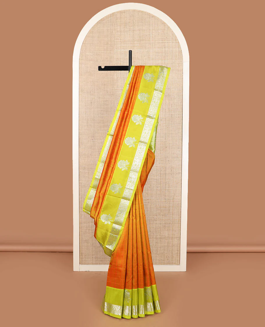 Orange checked Kanchipuram silk saree, contrast border of rose floral, rekku, banaras, and kuthirai designs, and intricate pallu