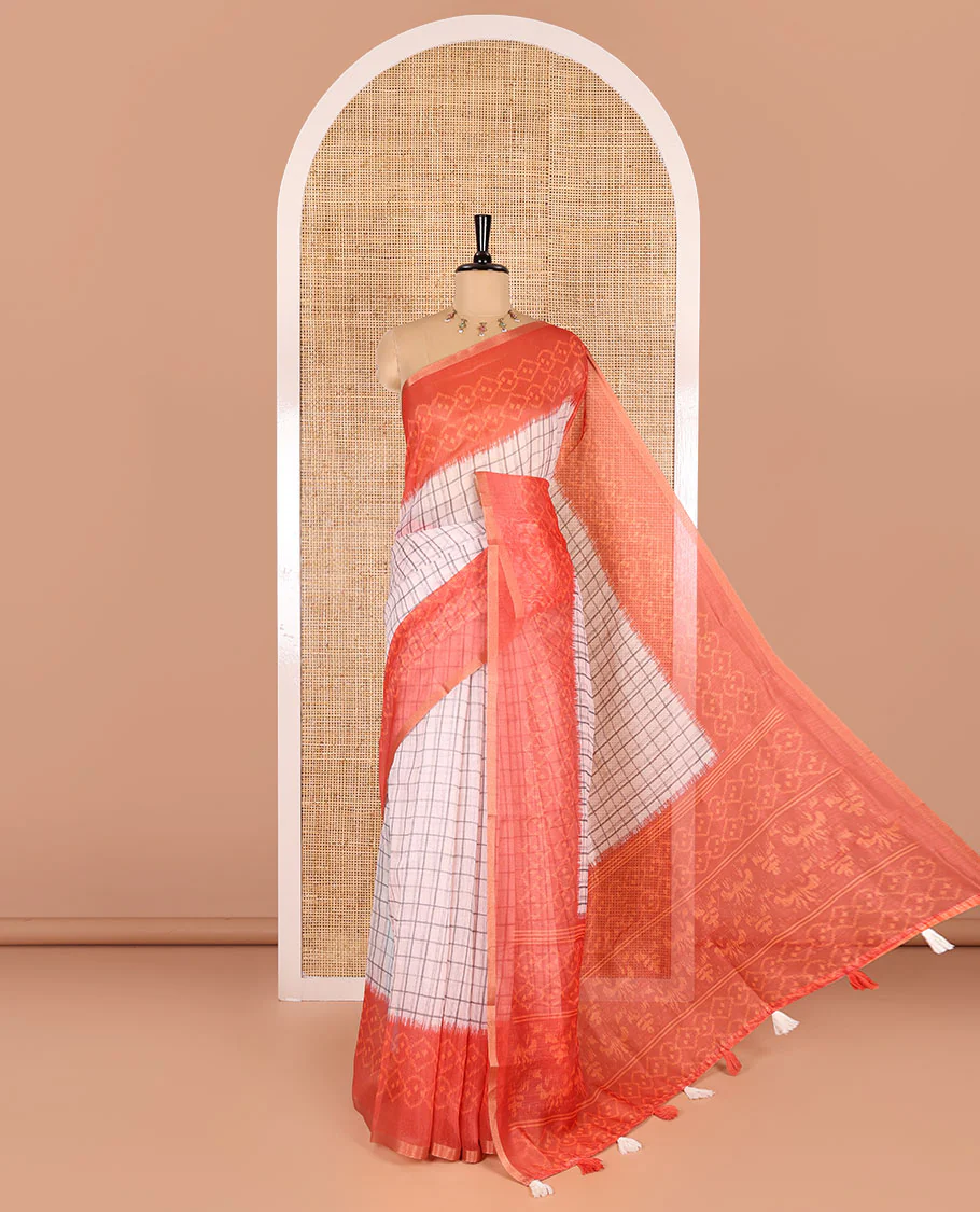 Orange checked linen cotton saree, contrast pochampally style geometric printed border, pochampally printed pallu, and a diamond patterns printed blouse