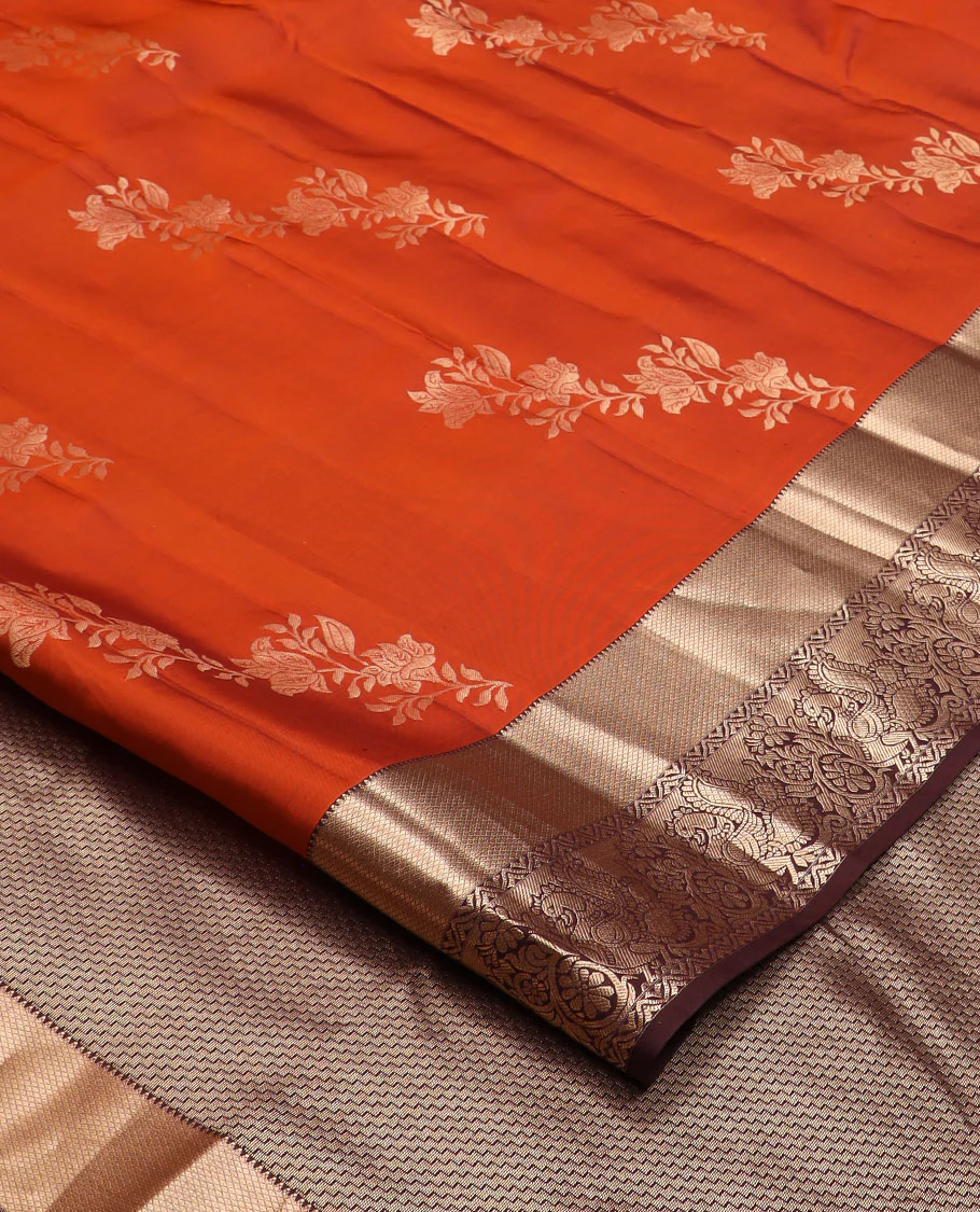 Orange floral buttas Vasundhara silk saree, contrast border of rekku, mayil kann, and mayil designs, and chevron striped pallu - Image 2